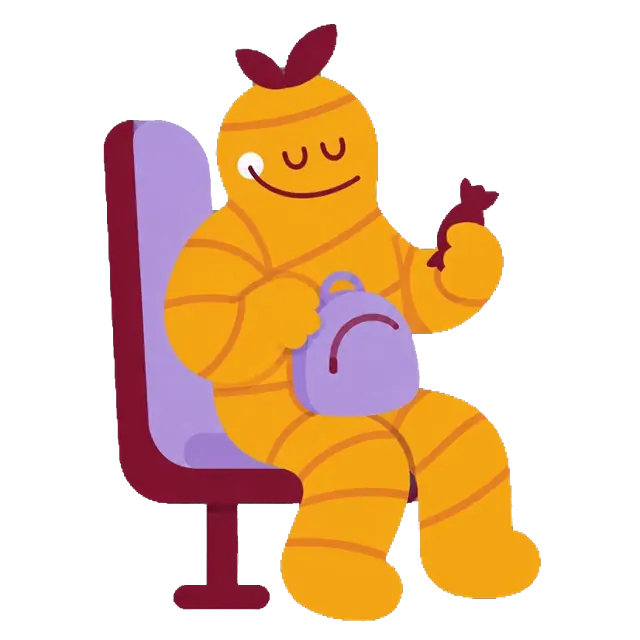 La mascota de Jengizitos viaja sentada en el bus, se come un caramelo y sigue el paseo contenta mirando por la ventana